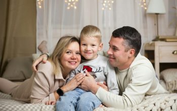 a family sitting on a couch